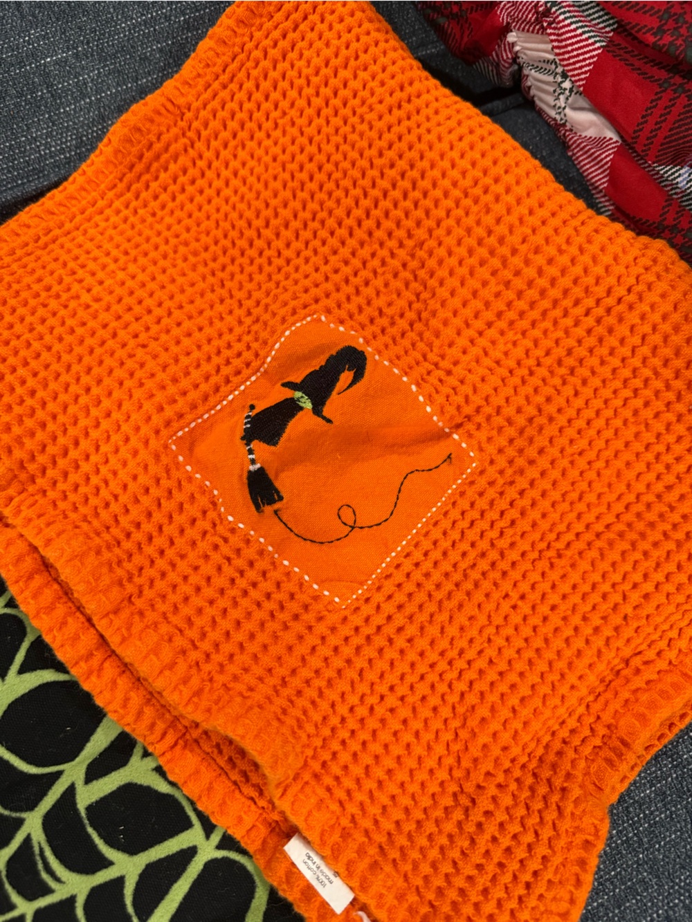 Kids Orange Waffle Knit Washcloth with Black witch Appliqué